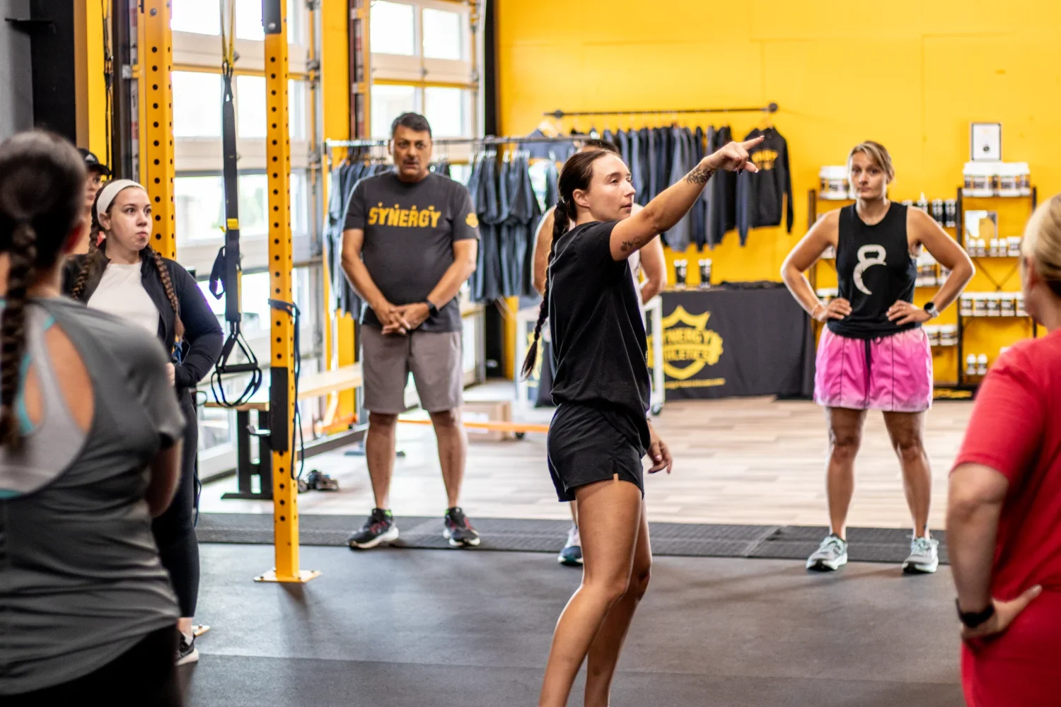 Members training on rowing machines during a conditioning session