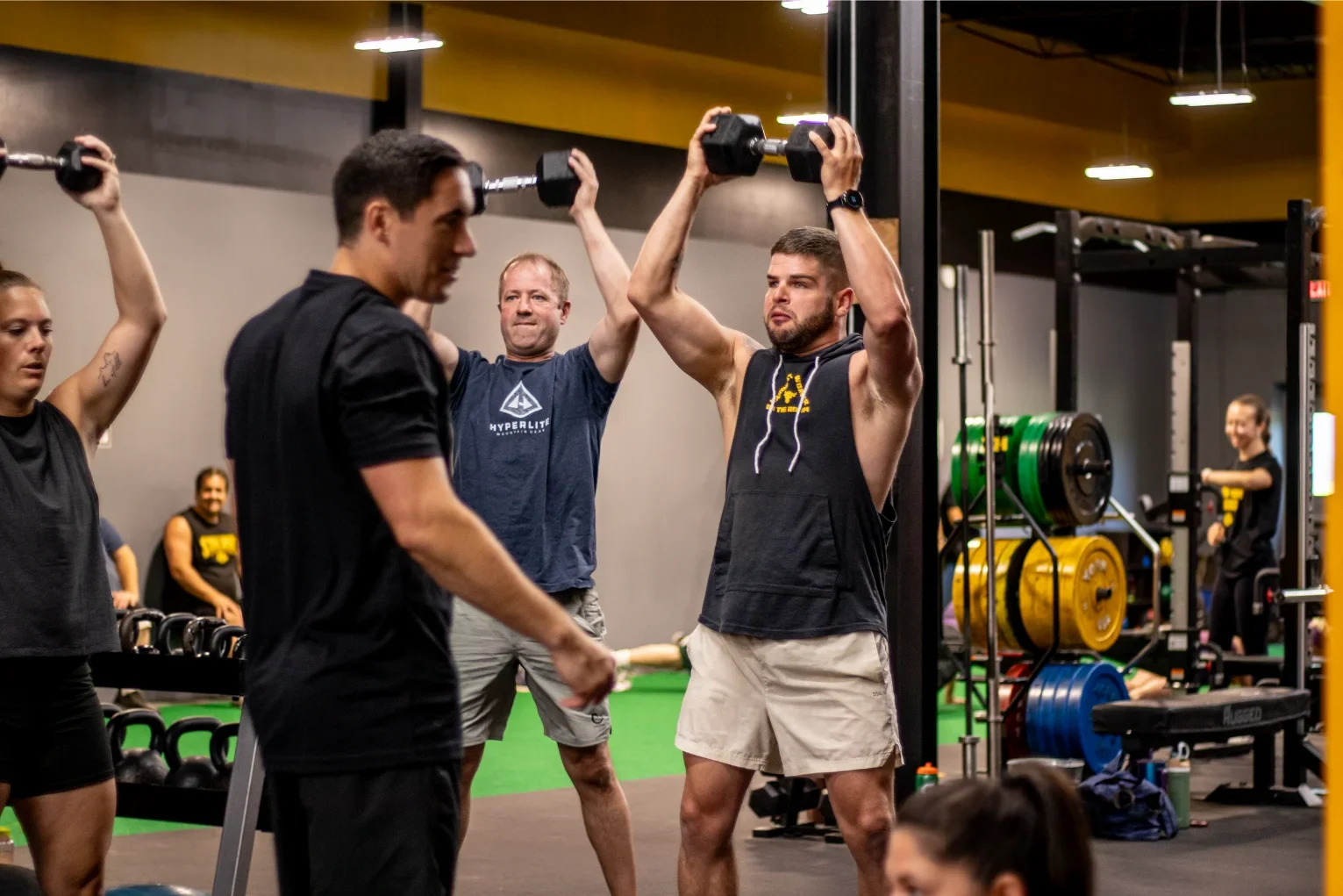 Synergy coach high-fiving a member during a Personal Fitness session